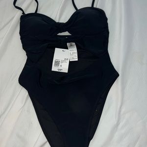 Forever 21 size small swimsuit . Open cut in the middle. Brand new w tags